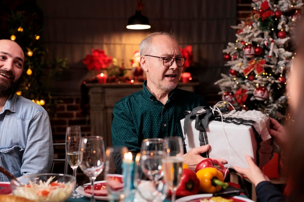 Happy Senior Couple Celebrating Christmas Spirit at Home – Free Stock Photo for Download