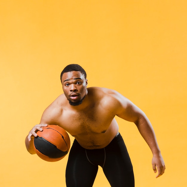 Athletic Man Playing Basketball Shirtless – Free Download