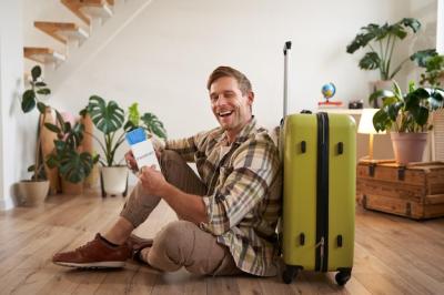 Handsome Charismatic Man Tourist with Suitcase Holding Passport – Free Stock Photo for Download