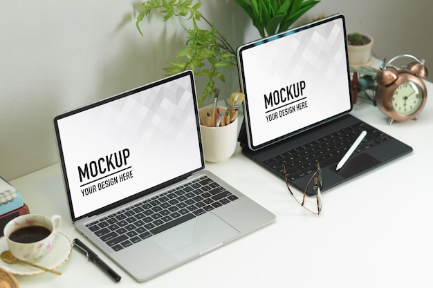 Cropped Shot of a Workspace Featuring a Laptop, Tablet, Decorations, and Coffee Cup – Free Download