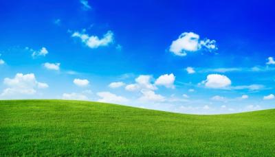 Stunning Green Hills Under a Bright Blue Sky – Free to Download