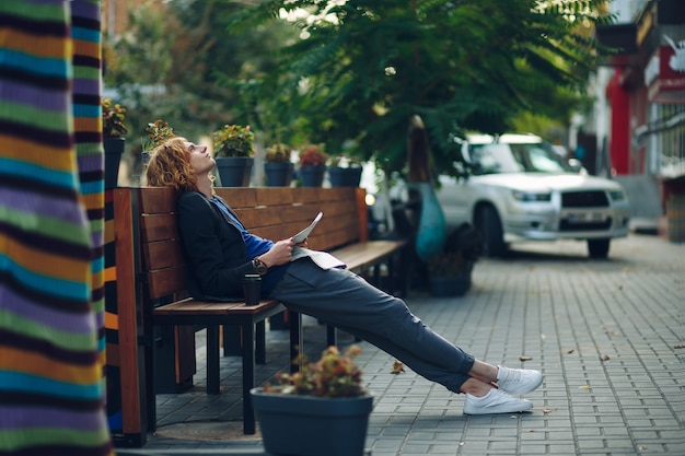 Man Dreaming on a Long Wooden Bench – Free Stock Photo for Download