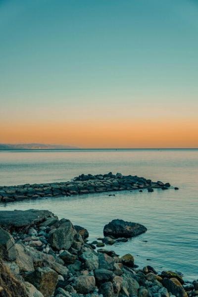 A Body of Water at Sunset – Free Stock Photo for Download