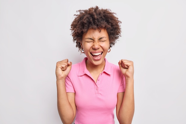 Joyful Afro American Woman Celebrating Success in Casual Pink T-Shirt – Free Download