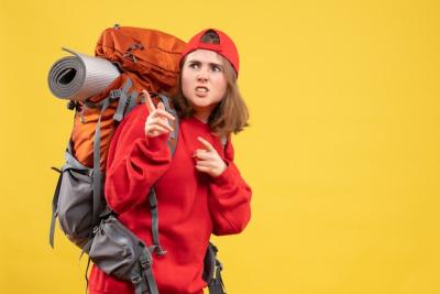 Wondered Traveller Woman in Red Backpack – Free Stock Photo for Download