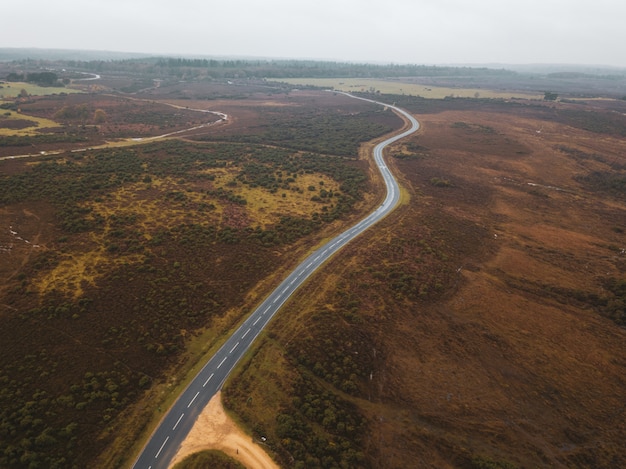 Aerial Shot of a Road in a Green Landscape in New Forest, UK – Free Download