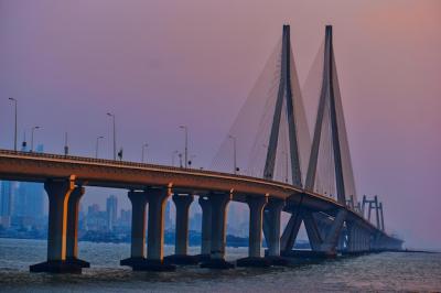 Sunset View of a Bridge Over a River Against a Clear Sky – Free Download