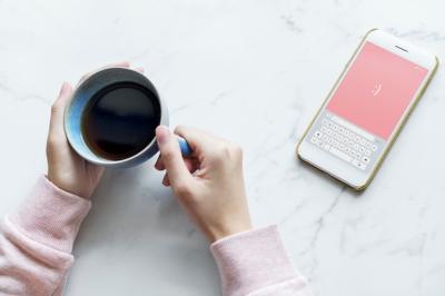 Aerial View of Woman Enjoying Coffee and Using Smartphone – Free Stock Photo for Download