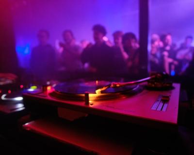 DJ Equipment and Dancing Crowds in Nightclubs – Free Download