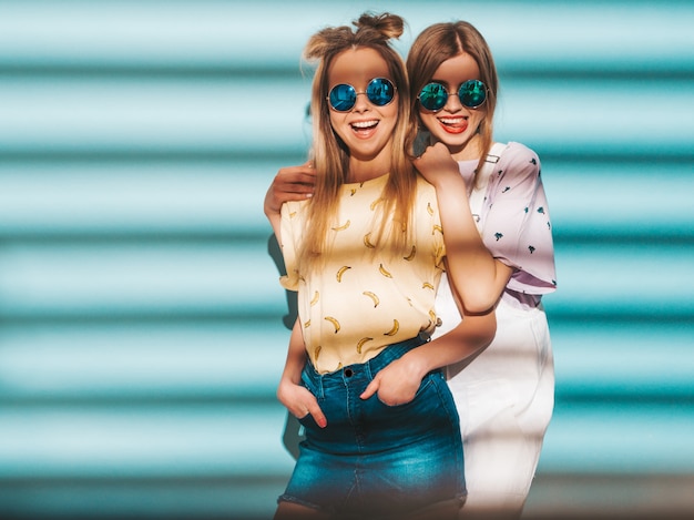 Two Young Beautiful Smiling Blond Hipster Girls in Trendy Summer Colorful T-Shirt Clothes – Free Download