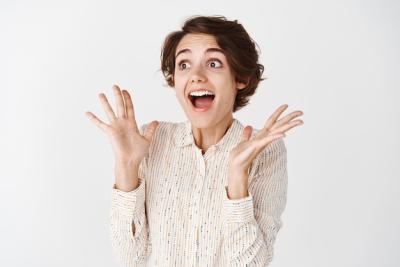 Excited Young Woman Gasping with Joy on White Background – Free Stock Photo, Download for Free