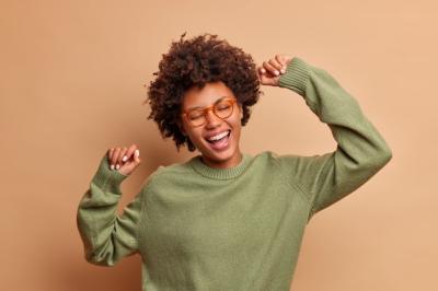 Carefree Young Woman Dancing with Transparent Glasses – Free Stock Photo for Download