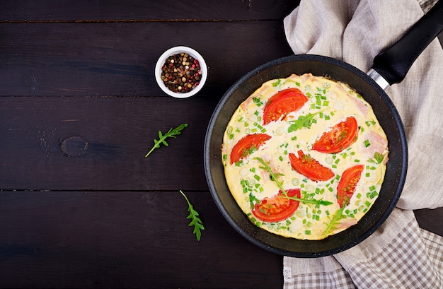 Omelette with Tomatoes, Ham, and Green Onion on Dark Table – Free Download