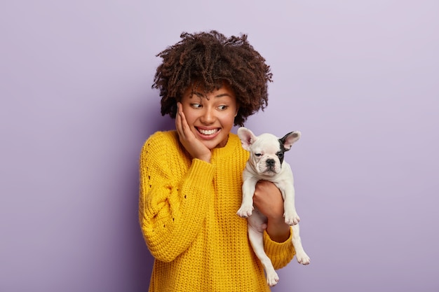 Afro American Woman Joyfully Purchasing a Pedigree Puppy – Free Stock Photo for Download