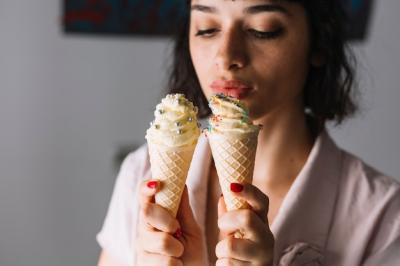 Beautiful Young Woman Enjoying Ice Cream Cones – Free to Download