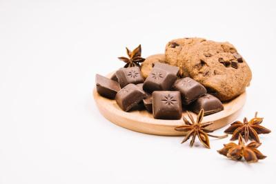 Chocolate Pieces and Cookies with Star Anise on Wooden Frame – Free Stock Photo for Download