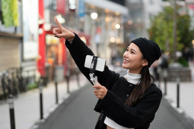 Young Japanese Influencer Capturing Vlog Moments – Free Download