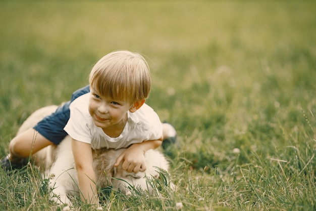 Blonde Boy Playing on Grass with Dog – Free Stock Photo, Download Free