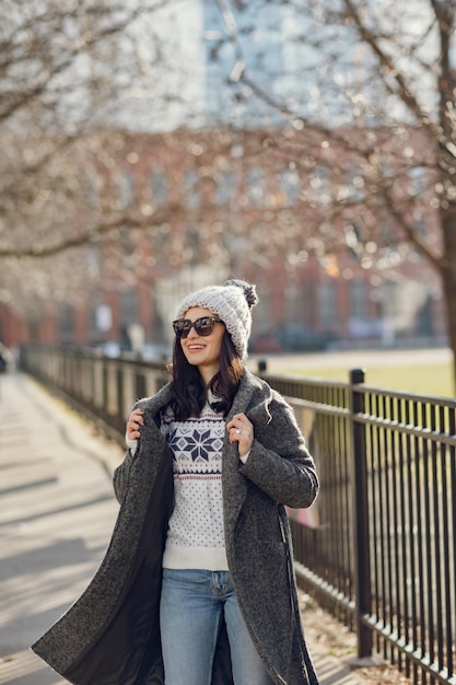 Charming Winter Strolls: Elegant Girl Walks in a City – Free Download