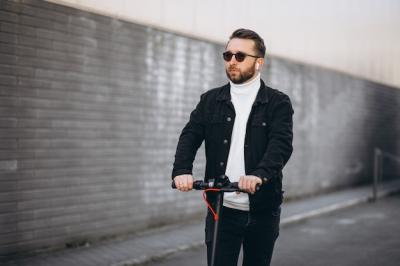 Handsome Man Riding a Scooter in Town – Free Stock Photo, Download for Free