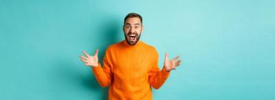 Happy and Excited Man Celebrating Big News: Free Stock Photo for Download