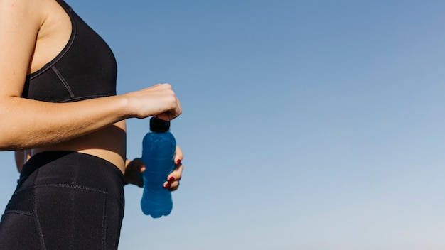 Sporty Woman with Plastic Bottle at the Beach – Free Stock Photo, Download Free