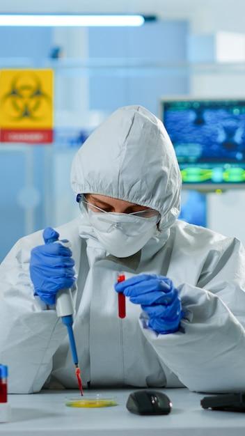 Science Technician Analyzing Blood Samples in Research Laboratory – Free Download