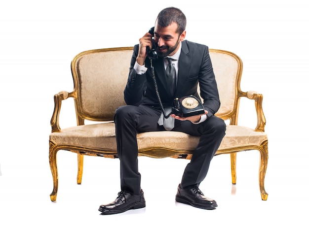 Businessman Talking on a Vintage Phone – Free to Download