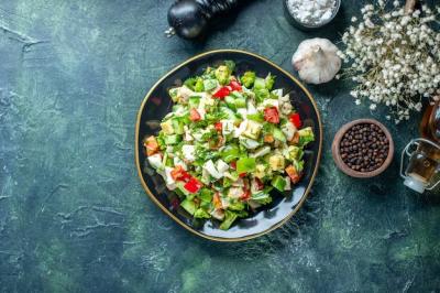 Colorful Vegetable Salad with Cucumber, Cheese, and Tomatoes on Dark-Blue Background – Free Download