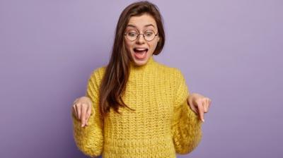 Young Woman in a Yellow Sweater – Free Stock Photo for Download