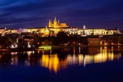 Illuminated Nighttime Cityscape Reflections in Water – Free to Download