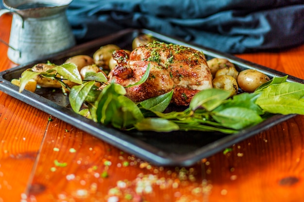 Garnished Roasted Turkey and Potatoes on Wooden Table – Free Stock Photo, Download for Free