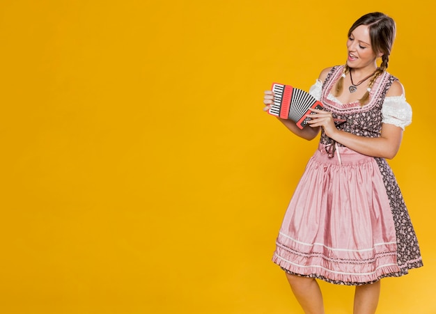 Festive Woman with Paper Accordion – Free Stock Photo for Download