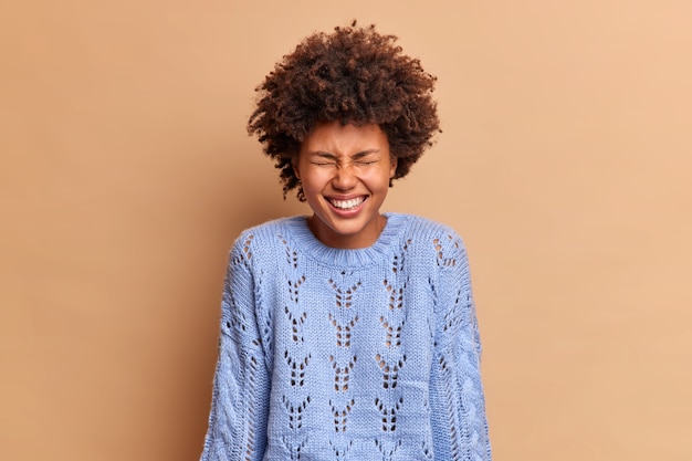 Overjoyed Woman Laughing with Curly Hair – Free Stock Photo for Download