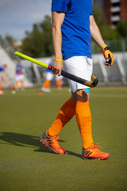 Field Hockey Player Training on Grass – Free Download