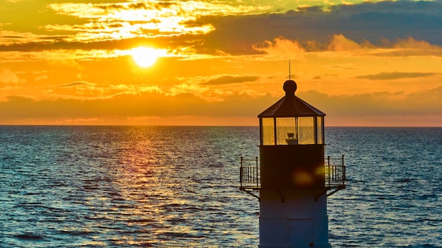 Aerial View of Lighthouse at Sunset Over Lake Michigan – Free Stock Photo Download