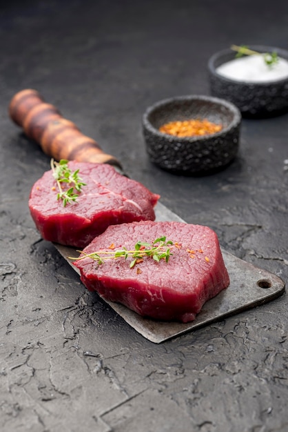 High Angle View of Meat on Cleaver Surrounded by Spices – Free Download