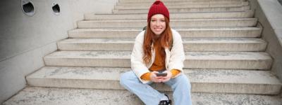 Hipster Redhead Woman Sitting on Stairs with Smartphone – Free Stock Photo Download