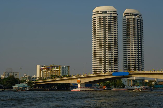 Bridge Over River with City Buildings Against the Sky – Free Stock Photo, Download for Free