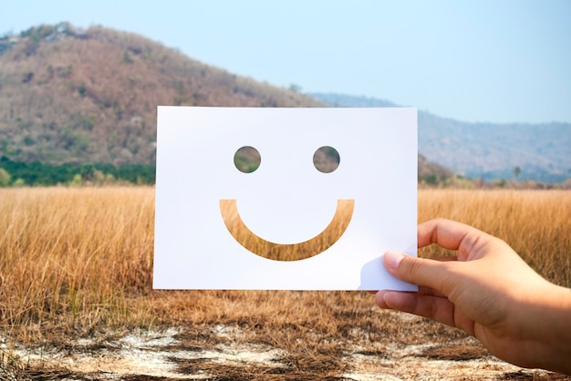 Cheerful Smiley Face on Perforated Paper – Free Download