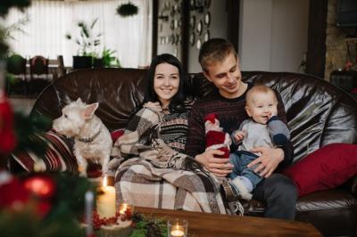 Parents with Baby, Dog on Couch at Christmas – Free Stock Photo, Download for Free