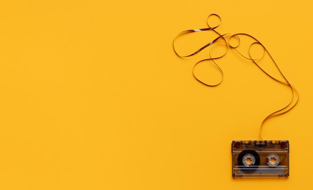 Cassette Tape on Yellow Background – Free to Download Stock Photo