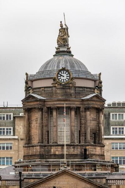 Clock Displaying 12:00 on a Building – Free Download