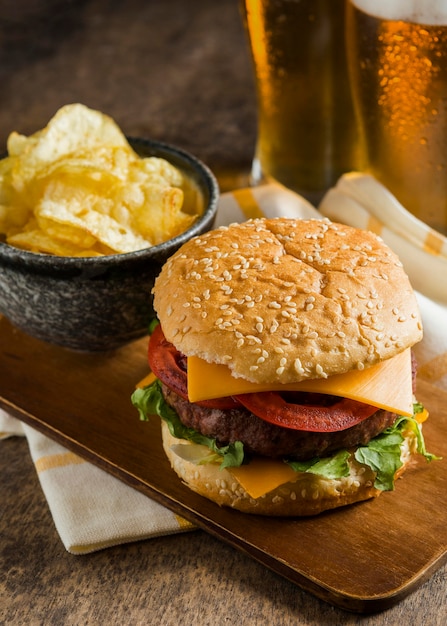 Glasses of Beer with Cheeseburger and Chips – Free Stock Photo for Download