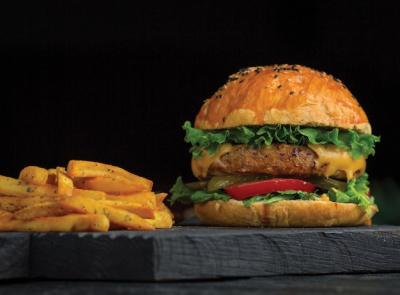 Big Mac Burger and Potato Sticks on a Dark Wooden Board – Free Stock Photo Download