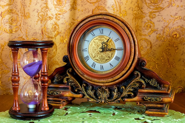 Old Clock and Sandglass on Brown Background – Free Stock Photo for Download