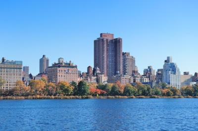 Autumn in Central Park: New York City Skyline Reflected on Lake with Colorful Foliage – Free Download