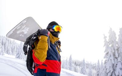 Snowboarder in Protective Glasses Holding Snowboard – Free Stock Photo Download