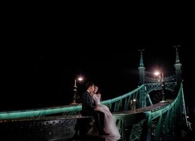 Beautiful Wedding Couple Kissing on an Illuminated Bridge at Night – Free Download