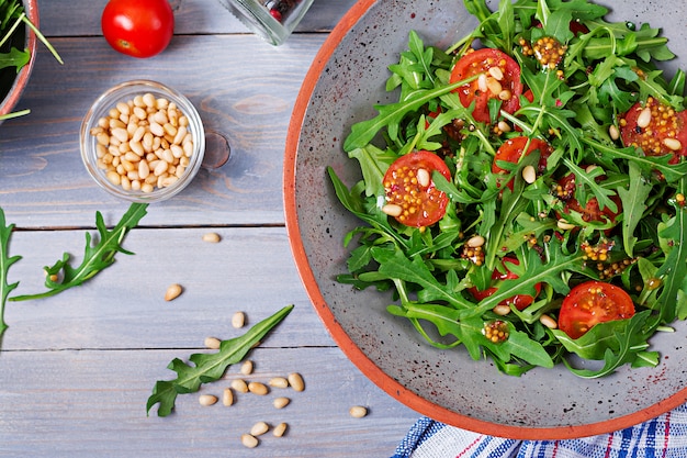 Dietary Menu: Healthy Vegan Salad with Arugula, Tomatoes, and Pine Nuts – Free Download